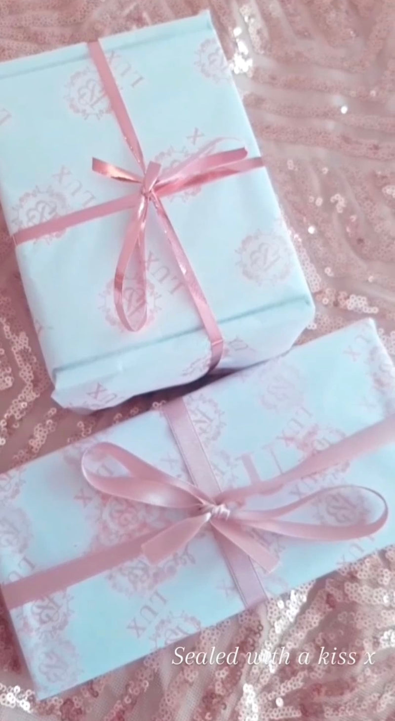 Boxes wrapped in SB Lux tissue Paper snd rose Gold Ribbon