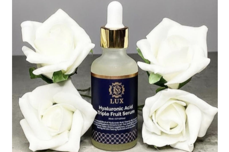 Hyaluronic acid serum amongst white flowers 