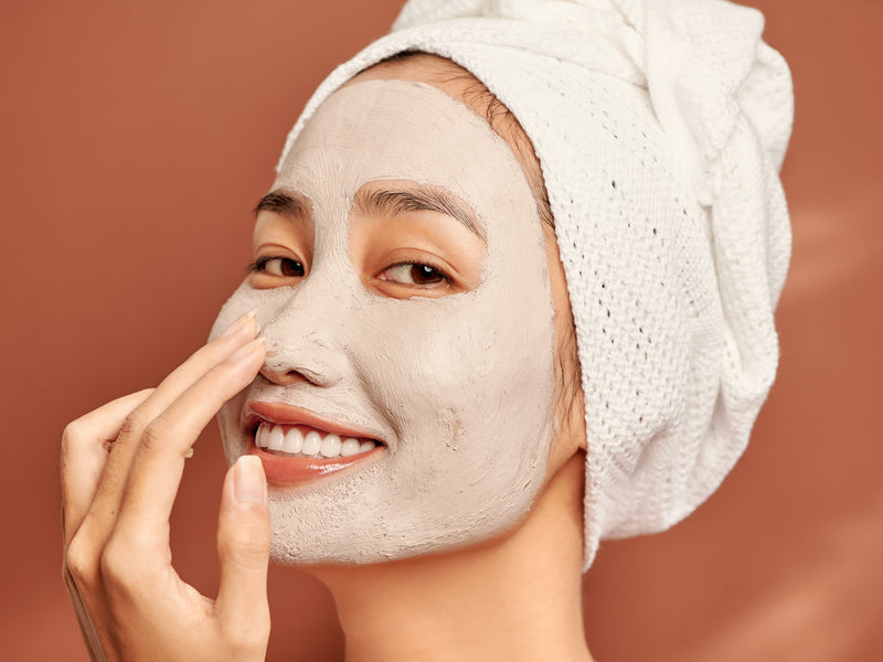 Smiling woman wearing exfoliating facemask. Suitable For men and woman. All skin types