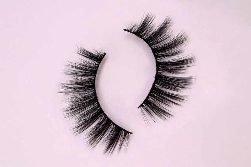 Wispy False Eyelashes on pink background 