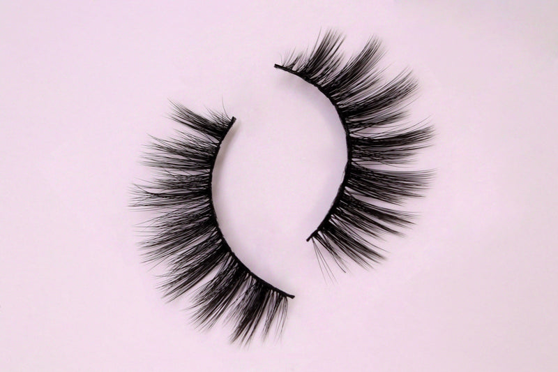 Wispy full silk lashes on pink background