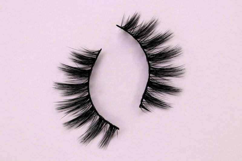 Wispy & Clustered false eyelashes on pink background 